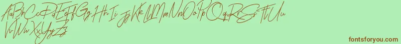 Rhesmanisa Demo-Schriftart – Braune Schriften auf grünem Hintergrund