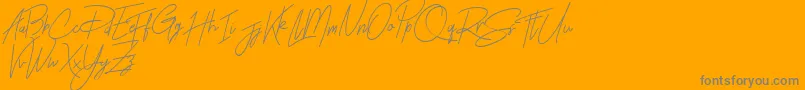 Rhesmanisa Demo-Schriftart – Graue Schriften auf orangefarbenem Hintergrund