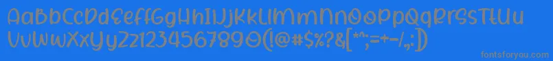 Rhigen Font by 7NTypes-fontti – harmaat kirjasimet sinisellä taustalla