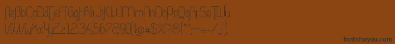 フォントRiasAltasRibadeoLGtipos Nor – 黒い文字が茶色の背景にあります