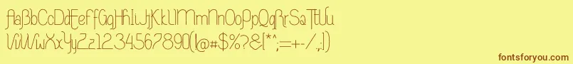 フォントRiasAltasRibadeoLGtipos Nor – 茶色の文字が黄色の背景にあります。