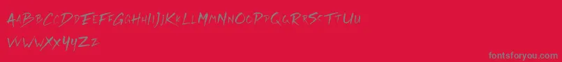 Rickies Free-fontti – harmaat kirjasimet punaisella taustalla