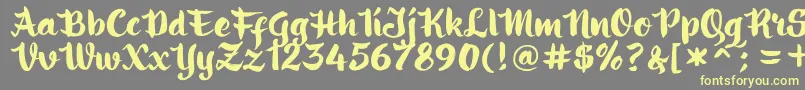 フォントringotube script – 黄色のフォント、灰色の背景