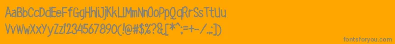 RingTown-fontti – harmaat kirjasimet oranssilla taustalla
