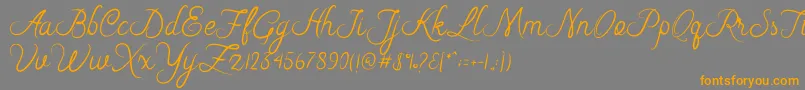 Riska Script Font – Orange Fonts on Gray Background