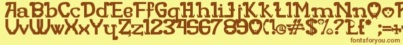 フォントRita Mouse – 茶色の文字が黄色の背景にあります。