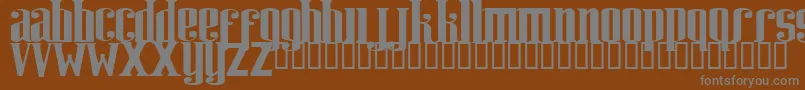 RIWEUK  -Schriftart – Graue Schriften auf braunem Hintergrund