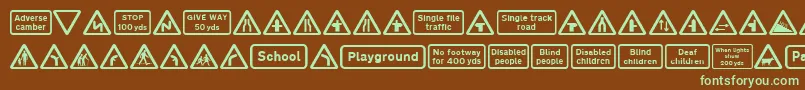 フォントRoad Caution Signs Part 1 – 緑色の文字が茶色の背景にあります。