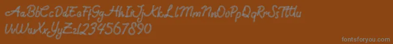 Fonte Rock Brush Pro – fontes cinzas em um fundo marrom