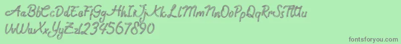 Rock Brush Pro Font – Gray Fonts on Green Background