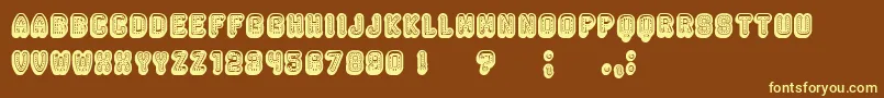 Rockefeller3DFancy-fontti – keltaiset fontit ruskealla taustalla