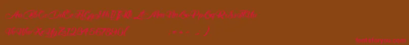 フォントMidnightValentine – 赤い文字が茶色の背景にあります。