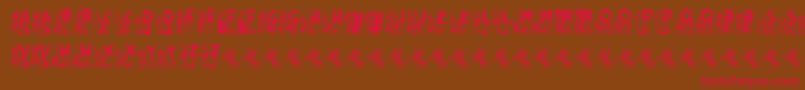 フォントRodeo CIES CAPS II – 赤い文字が茶色の背景にあります。