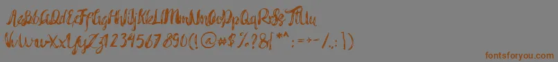 フォントRohman Grunge – 茶色の文字が灰色の背景にあります。