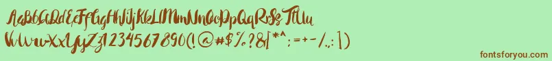 Rohman Regular-Schriftart – Braune Schriften auf grünem Hintergrund