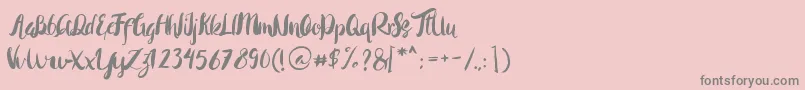 Rohman Regular-Schriftart – Graue Schriften auf rosa Hintergrund