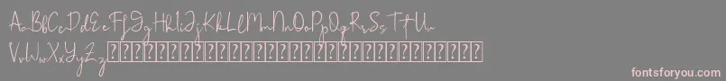 フォントRohmathan – 灰色の背景にピンクのフォント