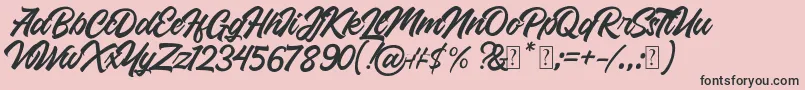 Roland-fontti – mustat fontit vaaleanpunaisella taustalla