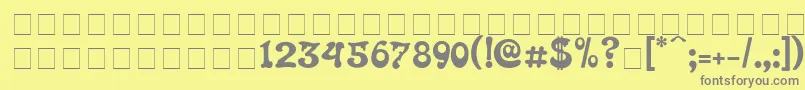 フォントRoland – 黄色の背景に灰色の文字