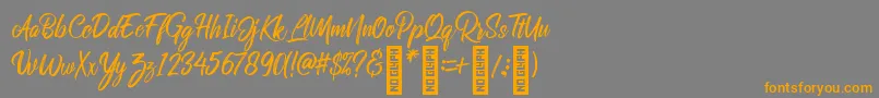 RolleteQaku Regular Font – Orange Fonts on Gray Background