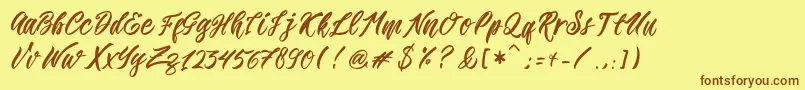 フォントRomansa – 茶色の文字が黄色の背景にあります。