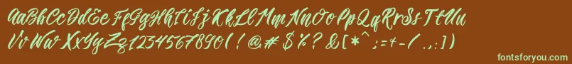 フォントRomansa – 緑色の文字が茶色の背景にあります。
