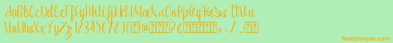 フォントRomansha – オレンジの文字が緑の背景にあります。