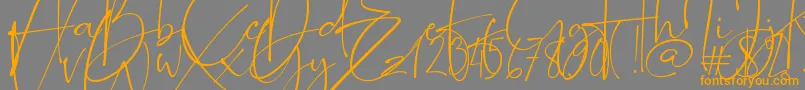 フォントRomantically – オレンジの文字は灰色の背景にあります。