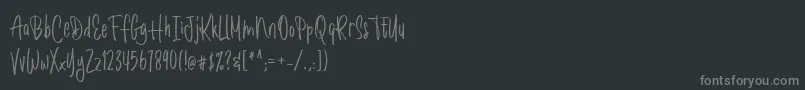フォントRomantick – 黒い背景に灰色の文字