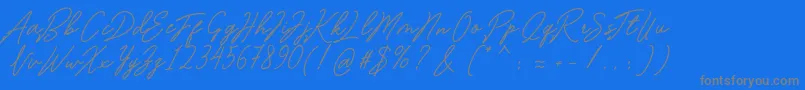 Romantina-fontti – harmaat kirjasimet sinisellä taustalla