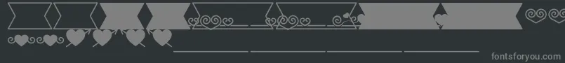 Fonte Romantine Dingbats – fontes cinzas em um fundo preto