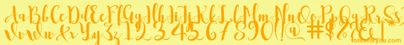 Romantis Font – Orange Fonts on Yellow Background