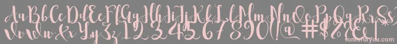 Romantis Font – Pink Fonts on Gray Background