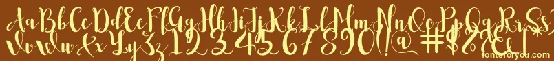 Romantis-fontti – keltaiset fontit ruskealla taustalla