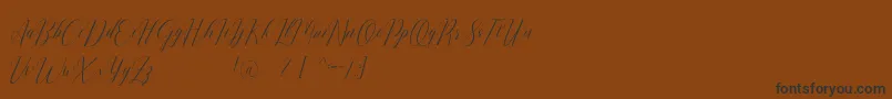 Шрифт Romarya dafont – чёрные шрифты на коричневом фоне