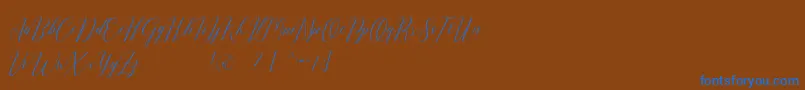 Romarya dafont Font – Blue Fonts on Brown Background