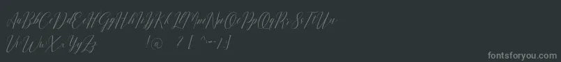 Romarya dafont-fontti – harmaat kirjasimet mustalla taustalla