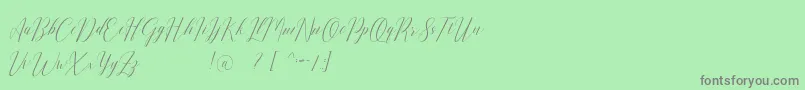 フォントRomarya dafont – 緑の背景に灰色の文字