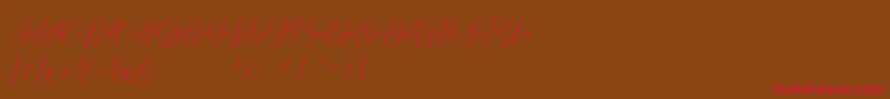フォントRomarya dafont – 赤い文字が茶色の背景にあります。