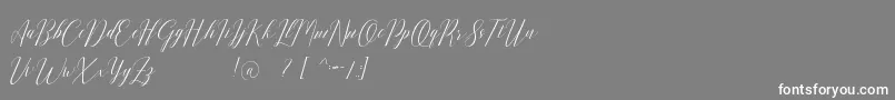 Шрифт Romarya dafont – белые шрифты на сером фоне