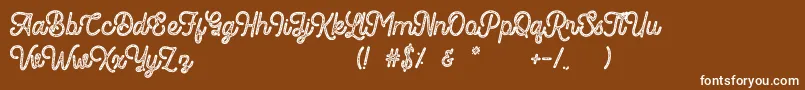 Romedhal Script Stamp-Schriftart – Weiße Schriften auf braunem Hintergrund