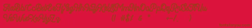 Fonte Romedhal Script Stamp – fontes marrons em um fundo vermelho