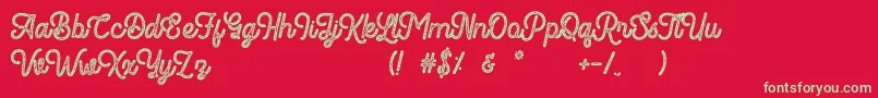 Romedhal Script Stamp Font – Green Fonts on Red Background