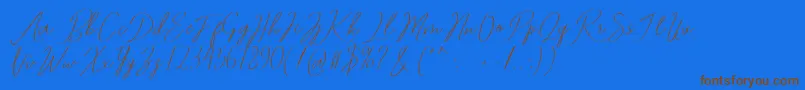 フォントRomtthing Free – 茶色の文字が青い背景にあります。