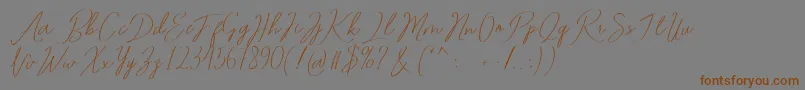 Romtthing Free-Schriftart – Braune Schriften auf grauem Hintergrund