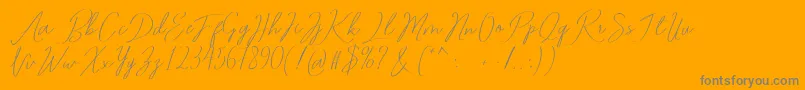 Romtthing Free-Schriftart – Graue Schriften auf orangefarbenem Hintergrund