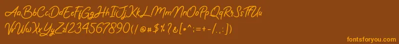 Romy  Jules Font – Orange Fonts on Brown Background
