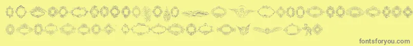 Fonte Rough Calligraphic Frames – fontes cinzas em um fundo amarelo