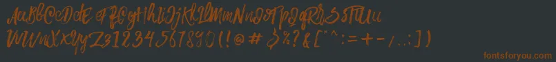 Шрифт Rowo Typeface  – коричневые шрифты на чёрном фоне