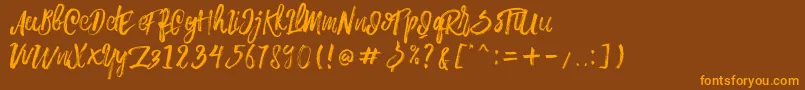 Шрифт Rowo Typeface  – оранжевые шрифты на коричневом фоне